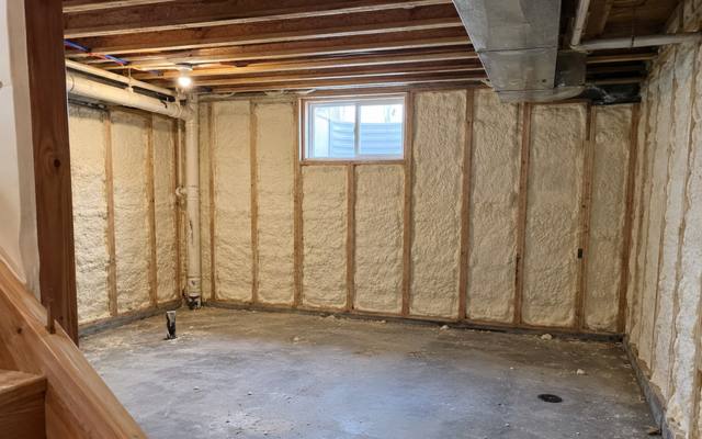 Basement with spray foam on the foundation walls